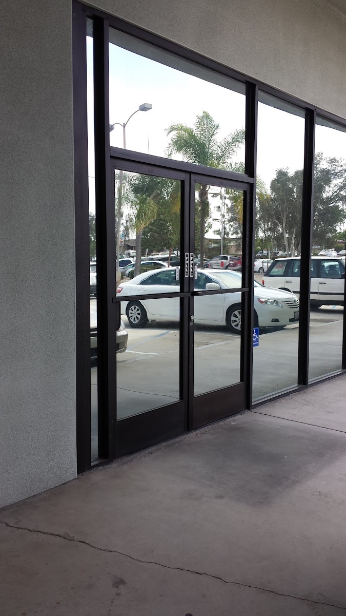Glass entrance to Suite 3B at 8363 Center Dr