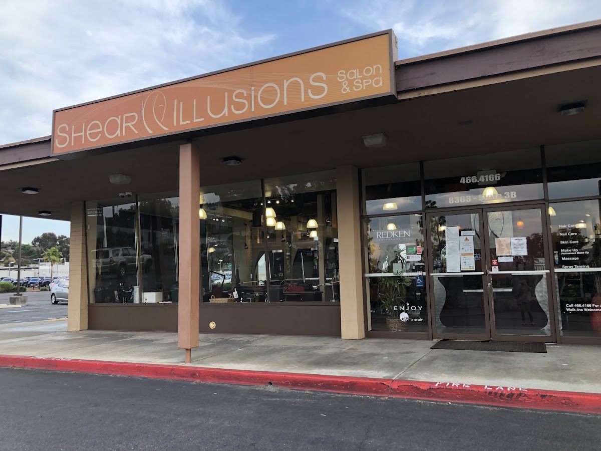 Shear Illusions Salon & Spa storefront on Center Dr by day